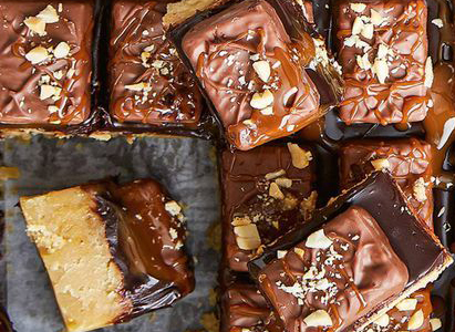 Snickers tray bake slice